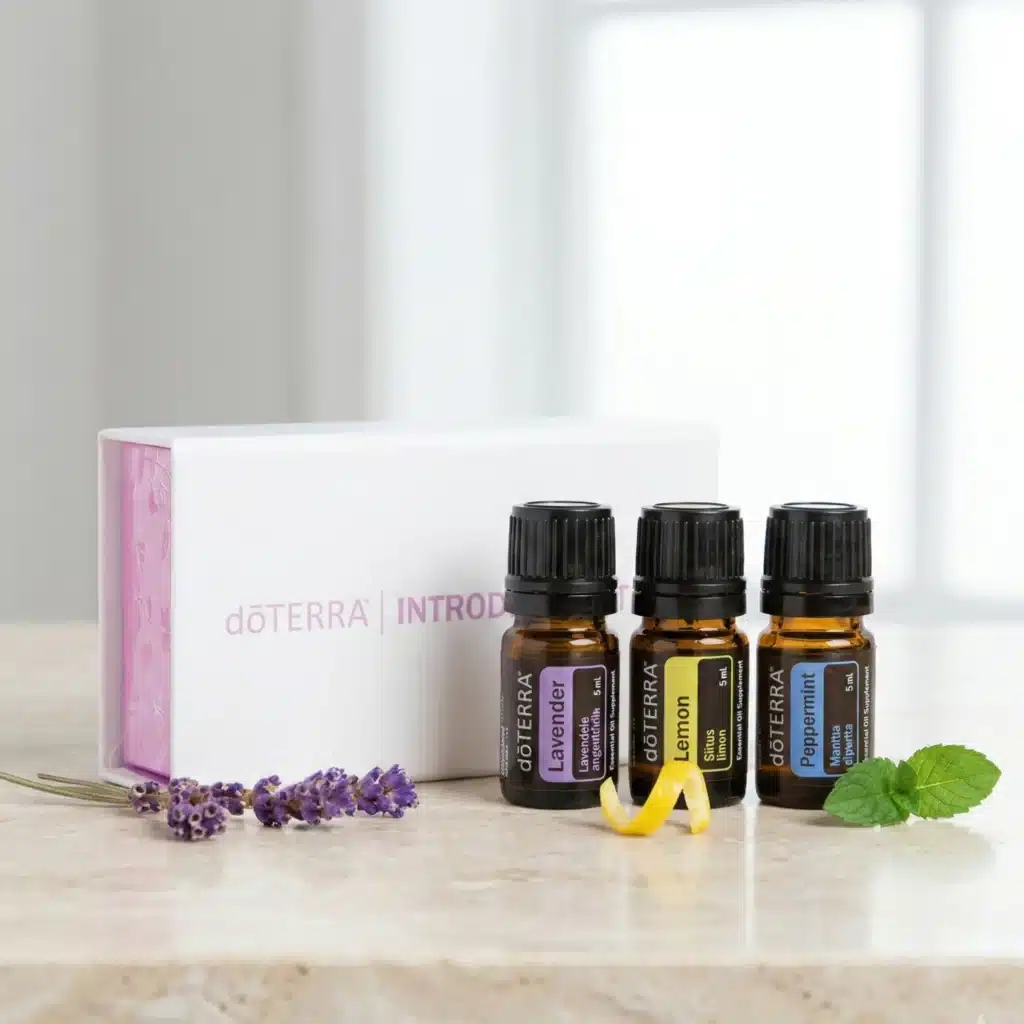 doTERRA Introductory Kit 3x5 ml – Levandule, Citron, Máta – oleje před krabičkou s bylinkami a plátkem citronu